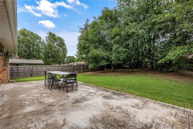 1801 Jean St, Springdale, AR 72762 - fenced backyard featuring outdoor dining space and a patio area