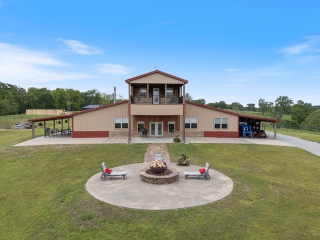 713 Madison Unit 8744, Huntsville, AR 72740 - rear view of house with a fire pit, a lawn, a carport, a balcony, and driveway