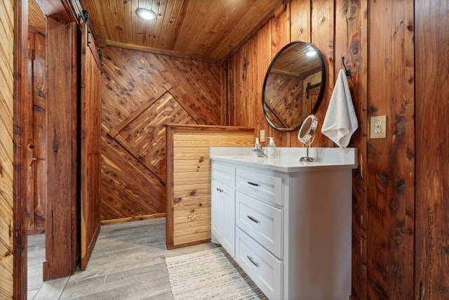 713 Madison Unit 8744, Huntsville, AR 72740 - bathroom featuring wooden walls, wood ceiling, wood finished floors, and vanity