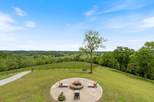 713 Madison Unit 8744, Huntsville, AR 72740 - view of yard featuring a fire pit, a patio, and a view of rural / pastoral area