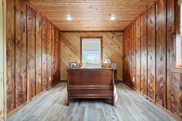 713 Madison Unit 8744, Huntsville, AR 72740 - bedroom with light wood-style floors, wood walls, and wood ceiling