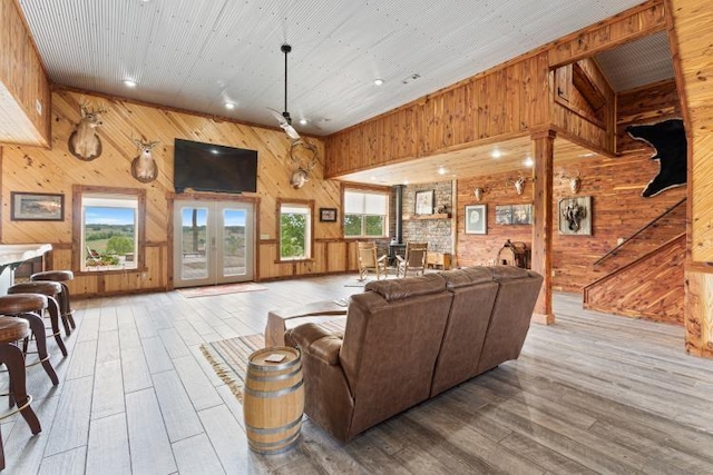 713 Madison Unit 8744, Huntsville, AR 72740 - living room featuring wooden walls, hardwood / wood-style flooring, french doors, and recessed lighting