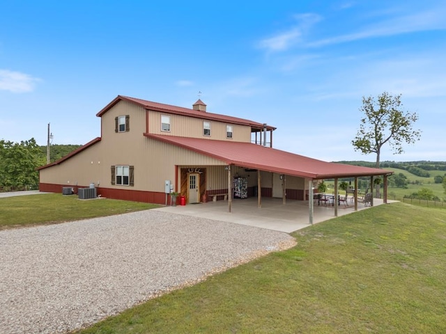 713 Madison Unit 8744, Huntsville, AR 72740 - back of house with a carport, driveway, a lawn, and central air condition unit