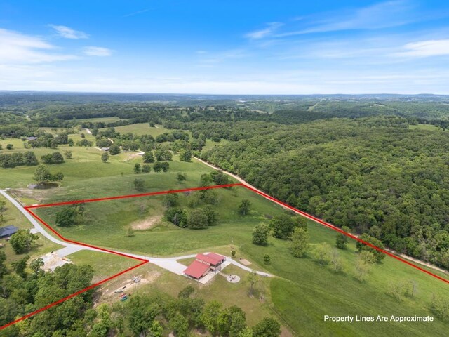 713 Madison Unit 8744, Huntsville, AR 72740 - view of property location with property boundaries highlighted and a heavily wooded area