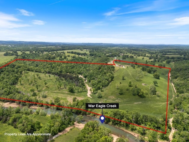 713 Madison Unit 8744, Huntsville, AR 72740 - aerial view of sparsely populated area with property parcel outlined and a forest