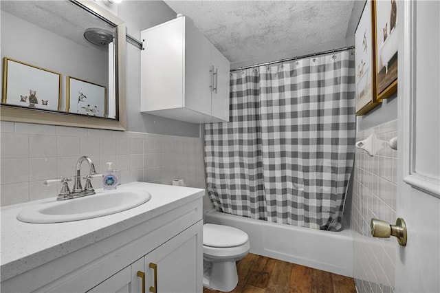 1 Morris Ln, Bella Vista, AR 72715 - full bathroom featuring toilet, shower / tub combo, vanity, a textured ceiling, and wood finished floors