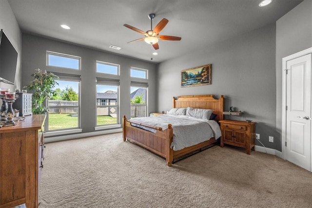 carpeted bedroom featuring recessed lighting and a ceiling fan