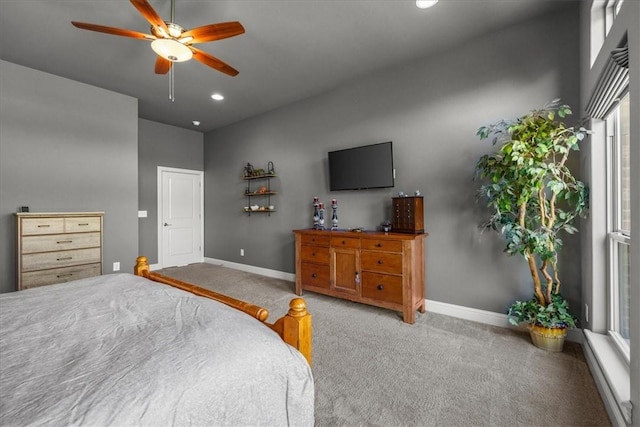 carpeted bedroom with baseboards, recessed lighting, ceiling fan, and multiple windows