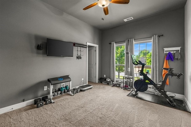 workout area with ceiling fan, carpet flooring, and baseboards
