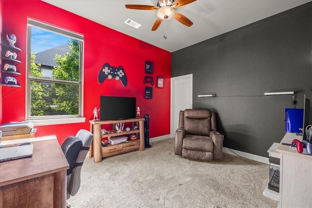 office with an accent wall, a ceiling fan, carpet floors, and baseboards