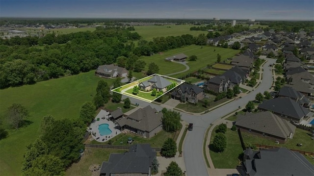 view of property location with property parcel outlined, a pool area, and nearby suburban area