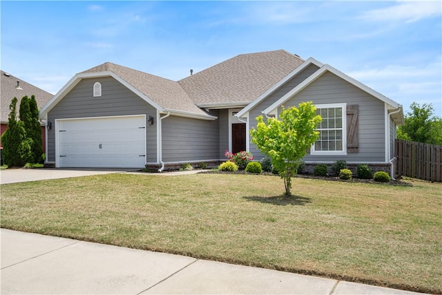 view of front of property with an attached garage, concrete driveway, and roof with shingles