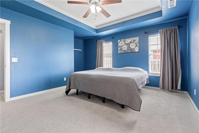 bedroom with crown molding, carpet floors, baseboards, and ceiling fan