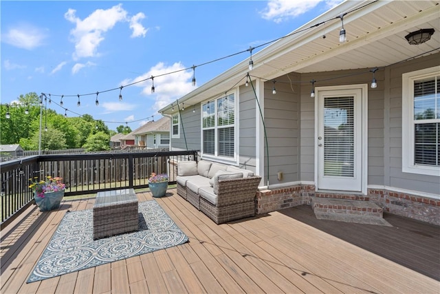 wooden deck with an outdoor hangout area