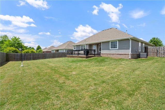 back of house with a wooden deck and brick siding