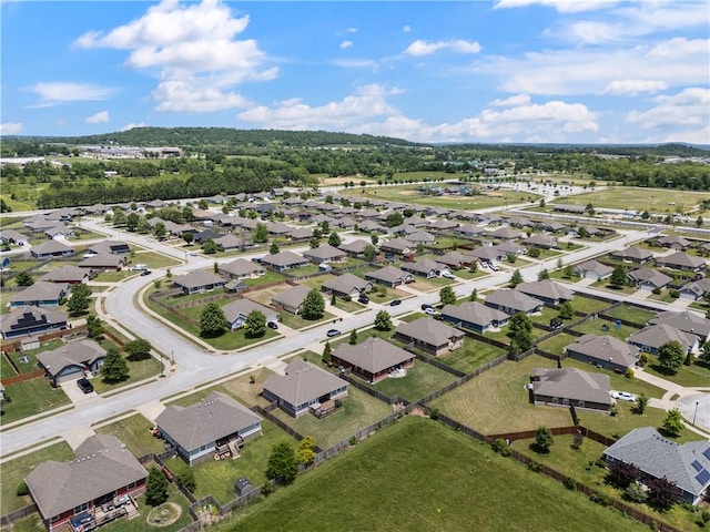 aerial view of property and surrounding area featuring nearby suburban area