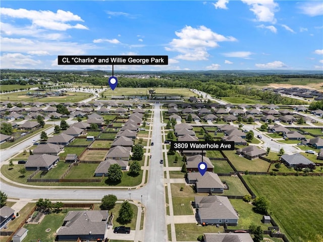 aerial view of property's location featuring nearby suburban area