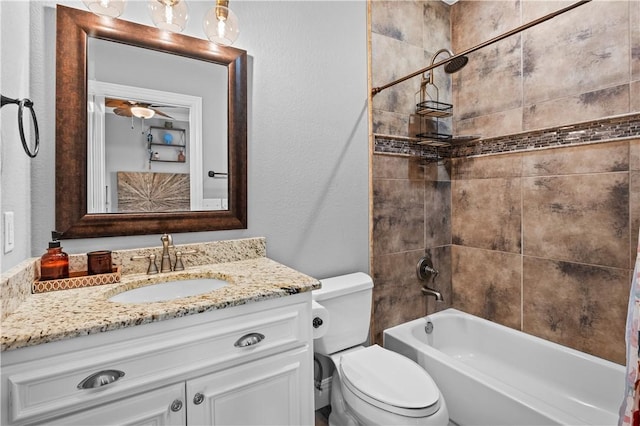full bathroom featuring vanity, toilet, shower / bath combo with shower curtain, and a textured wall