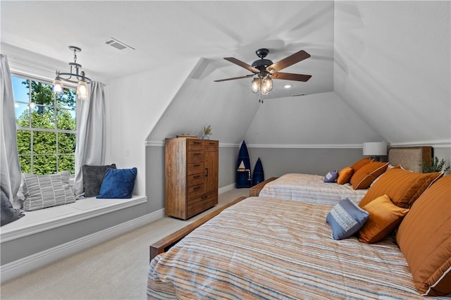 carpeted bedroom with lofted ceiling, baseboards, and a ceiling fan
