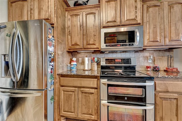 6201 S 36th St, Rogers, AR 72758 - kitchen featuring stainless steel appliances, stone countertops, and decorative backsplash