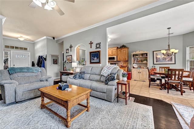 6201 S 36th St, Rogers, AR 72758 - living area featuring a chandelier, a ceiling fan, light wood-style floors, and crown molding