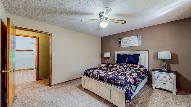 bedroom with light carpet, baseboards, a textured ceiling, and ceiling fan