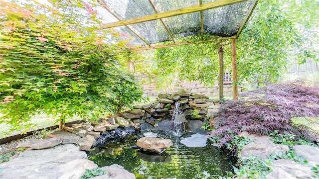 view of yard with a garden pond