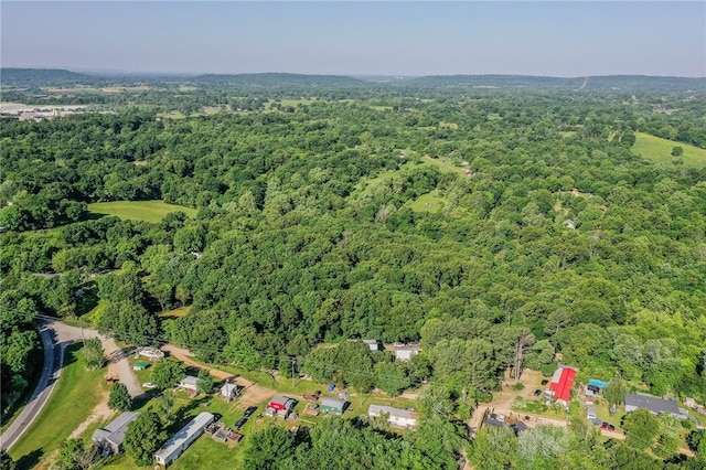 aerial overview of property's location featuring a heavily wooded area