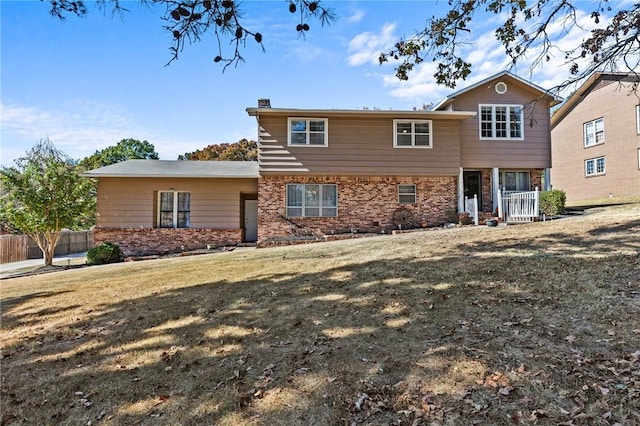 206 Suttle Dr, Springdale, AR 72764 - view of front facade featuring brick siding and a chimney
