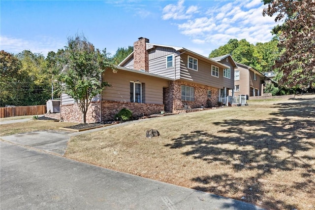 206 Suttle Dr, Springdale, AR 72764 - view of side of property featuring brick siding and a chimney