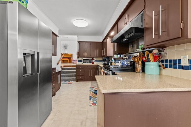 206 Suttle Dr, Springdale, AR 72764 - kitchen featuring appliances with stainless steel finishes, under cabinet range hood, backsplash, light stone counters, and dark brown cabinets