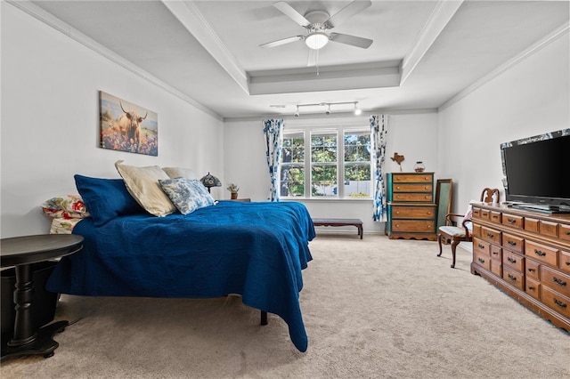206 Suttle Dr, Springdale, AR 72764 - carpeted bedroom with a tray ceiling, ornamental molding, and a ceiling fan