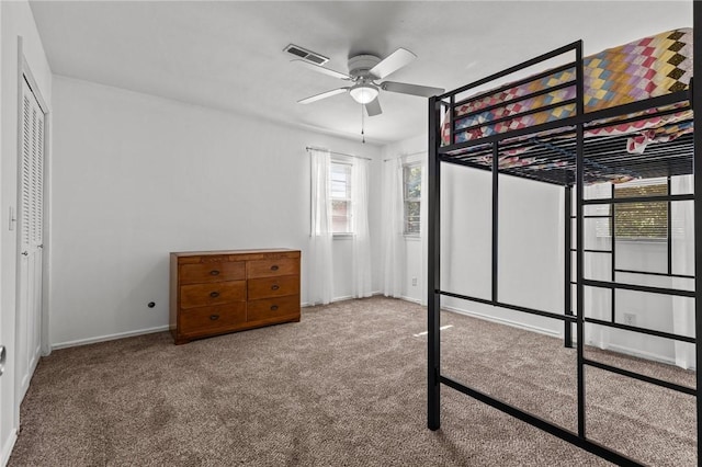 206 Suttle Dr, Springdale, AR 72764 - unfurnished bedroom featuring carpet, ceiling fan, and a closet