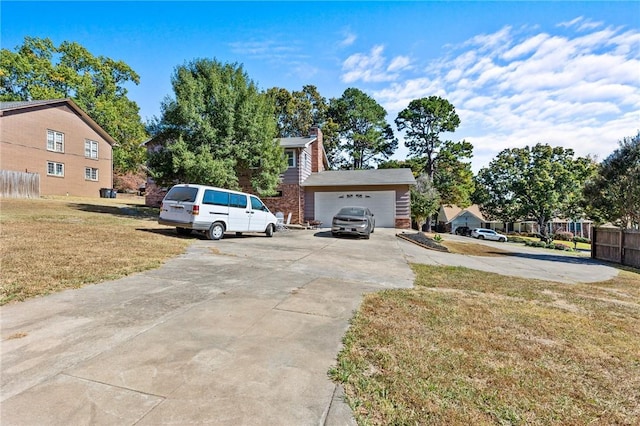206 Suttle Dr, Springdale, AR 72764 - view of property exterior featuring a garage, a chimney, driveway, and brick siding