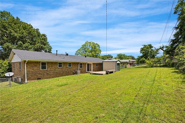 208 Date St, Russellville, AR 72802 - rear view of property with a storage shed, brick siding, an outdoor structure, central AC, and crawl space