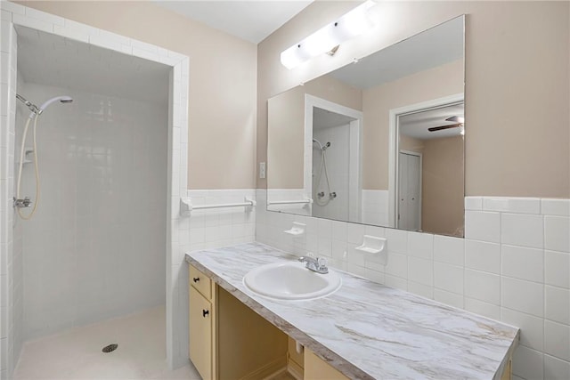 208 Date St, Russellville, AR 72802 - bathroom with tiled shower, tile walls, and vanity