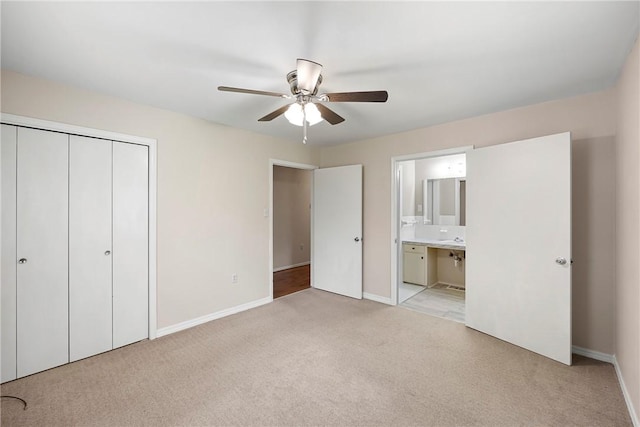 208 Date St, Russellville, AR 72802 - unfurnished bedroom with light colored carpet, baseboards, a closet, and ensuite bathroom