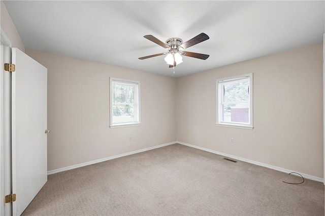 208 Date St, Russellville, AR 72802 - carpeted empty room featuring healthy amount of natural light, ceiling fan, and baseboards