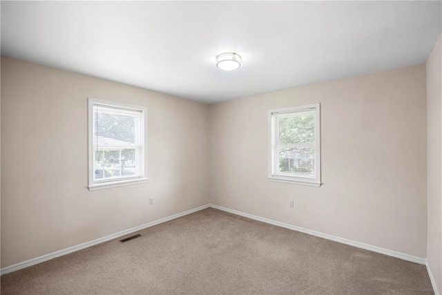 208 Date St, Russellville, AR 72802 - carpeted empty room with healthy amount of natural light and baseboards