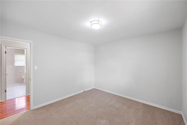 208 Date St, Russellville, AR 72802 - spare room featuring carpet floors and baseboards