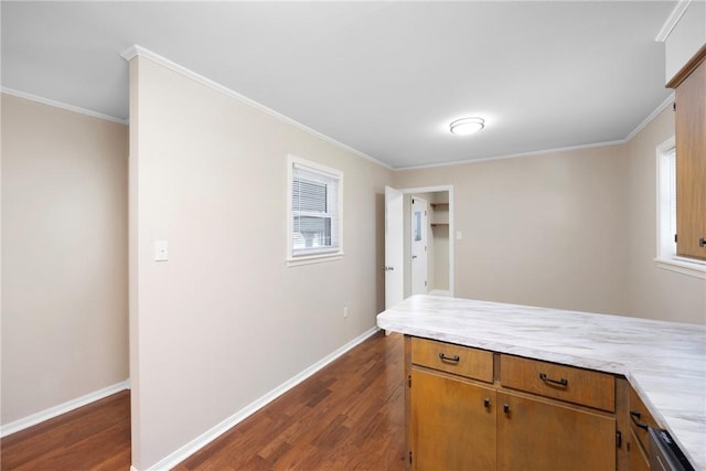 208 Date St, Russellville, AR 72802 - kitchen with ornamental molding, light countertops, dark wood-style floors, baseboards, and brown cabinets