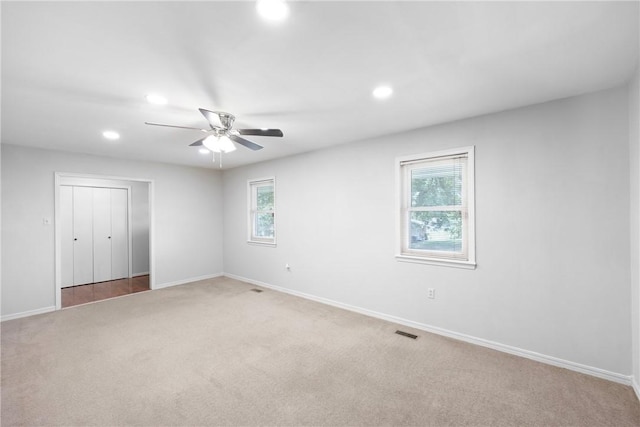 208 Date St, Russellville, AR 72802 - unfurnished bedroom featuring light colored carpet, recessed lighting, baseboards, ceiling fan, and a closet
