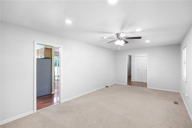 208 Date St, Russellville, AR 72802 - unfurnished bedroom featuring refrigerator, carpet, recessed lighting, baseboards, and a ceiling fan