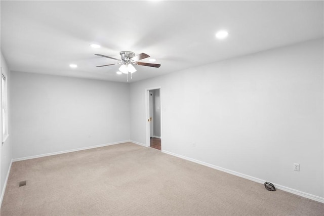 208 Date St, Russellville, AR 72802 - spare room with light carpet, a ceiling fan, recessed lighting, and baseboards