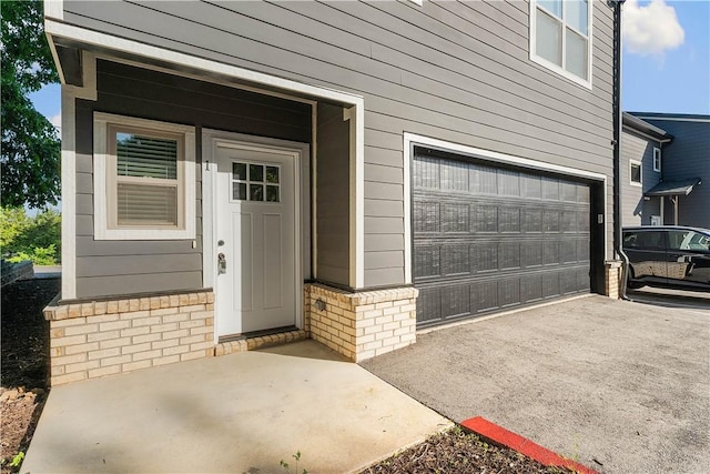 293 W Ash St Unit 1, Fayetteville, AR 72703 - doorway to property with a garage and brick siding