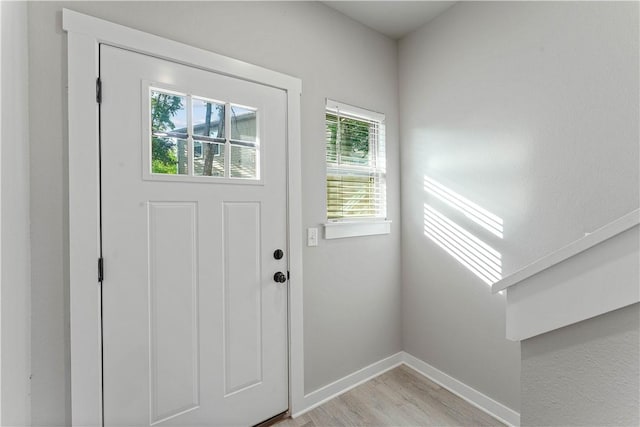 293 W Ash St Unit 1, Fayetteville, AR 72703 - foyer featuring light wood-type flooring and baseboards