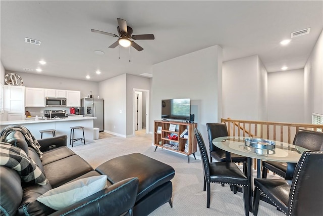 293 W Ash St Unit 1, Fayetteville, AR 72703 - living area featuring light colored carpet, a ceiling fan, recessed lighting, and baseboards