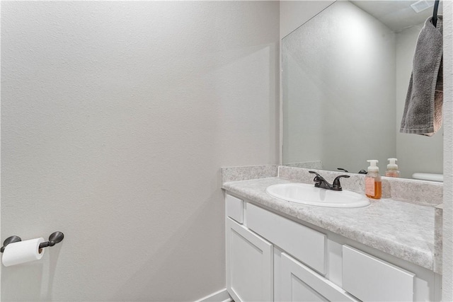 293 W Ash St Unit 1, Fayetteville, AR 72703 - bathroom with vanity and baseboards