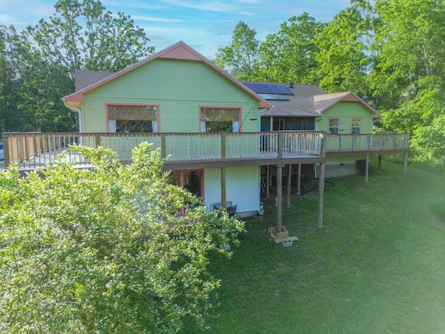 10190 Summit Dr, Rogers, AR 72758 - rear view of property featuring a wooden deck, solar panels, and a yard