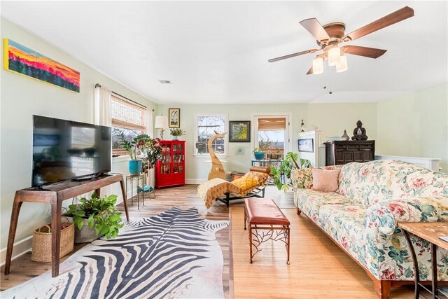 10190 Summit Dr, Rogers, AR 72758 - living room with light wood-type flooring, a ceiling fan, and baseboards